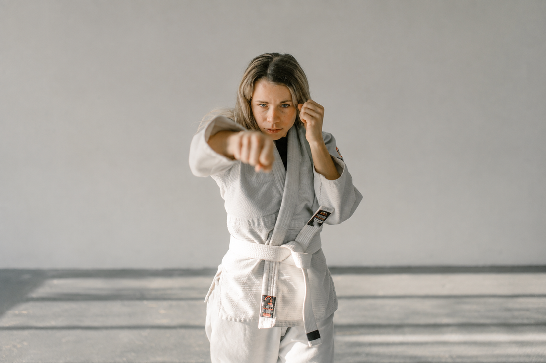 Adult beginner training Kyokushin karate in a dojo