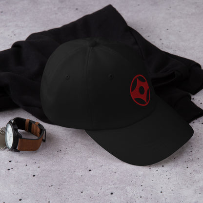 Black cap and watch on a textured surface