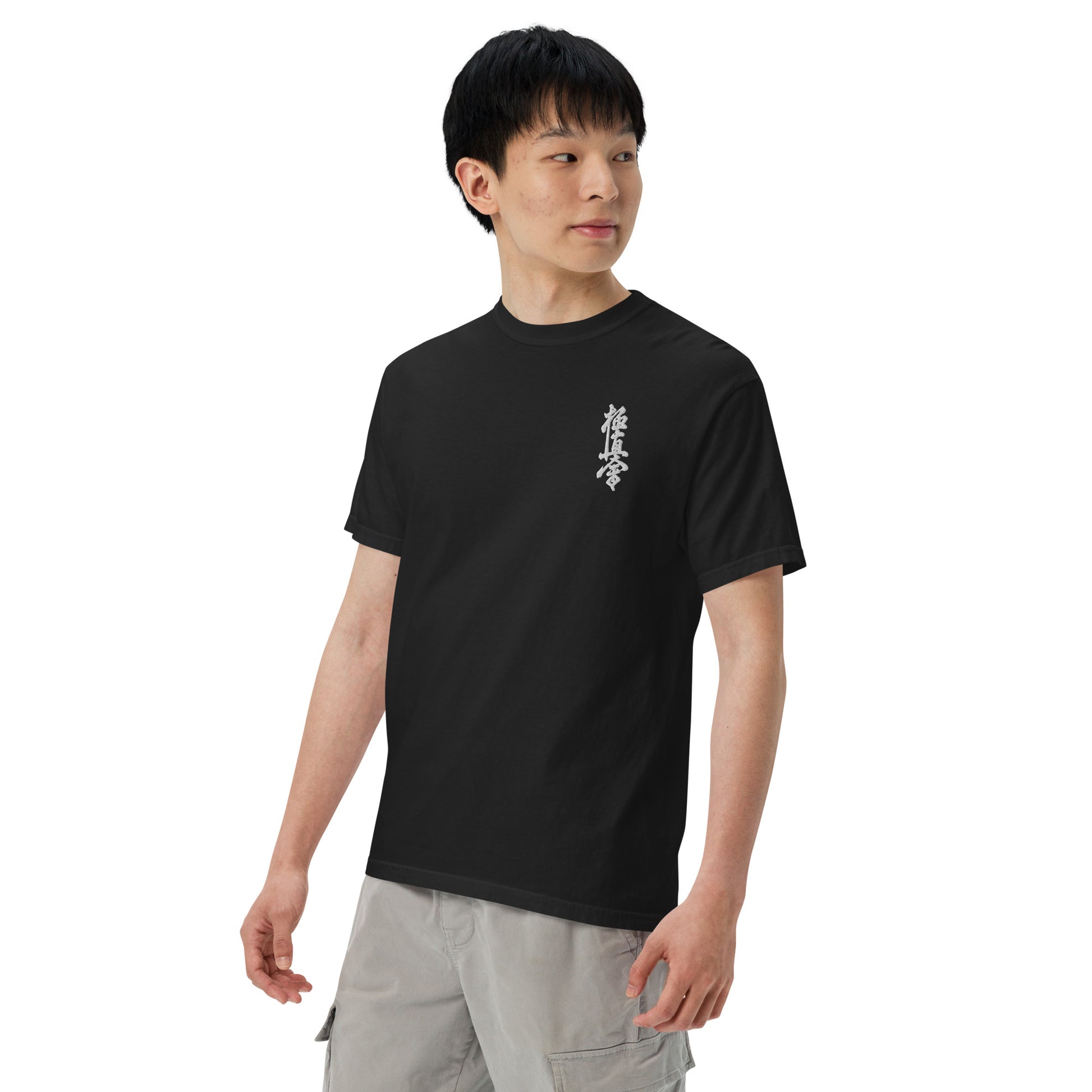 Person wearing a black t-shirt with a logo on a white background