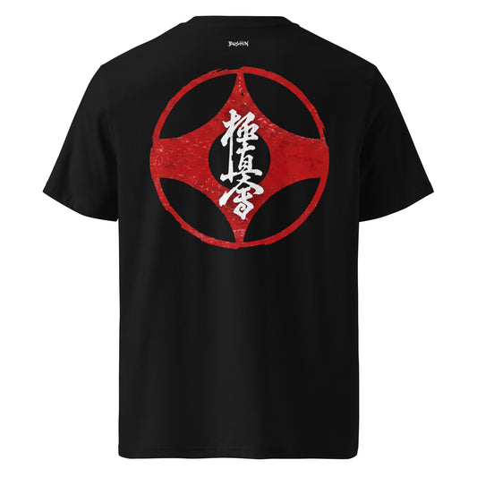 A black short-sleeve t-shirt shown from the back, featuring a large distressed red circular graphic with white Japanese calligraphy in the center.