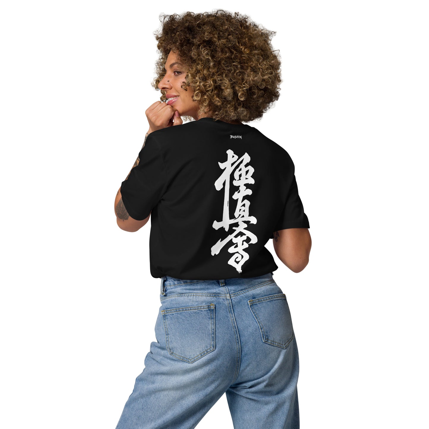 Person wearing a black t-shirt with 'The 2 AM Club' text and graphic on the back.