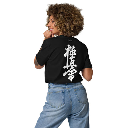 Person wearing a black t-shirt with 'The 2 AM Club' text and graphic on the back.