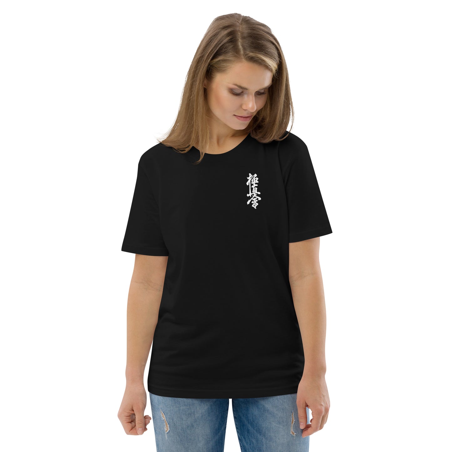 Woman wearing a black t-shirt with a small graphic and text on a white background