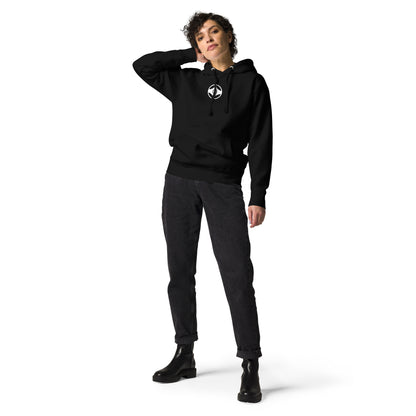 Person wearing a black hoodie with a logo on a white background