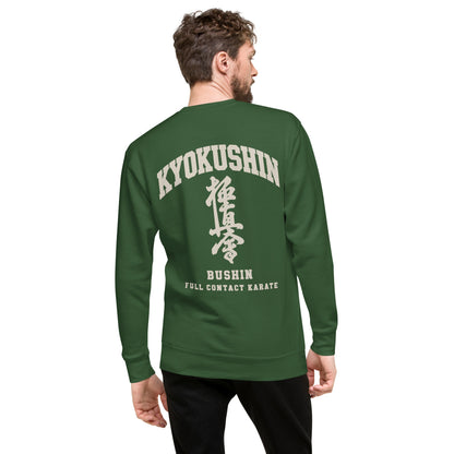 A man wearing a dark green long-sleeve sweatshirt, viewed from the back. The sweatshirt features a large white graphic print on the back with the words 'KYOKUSHIN', Japanese characters, 'BUSHIN', and 'FULL CONTACT KARATE'.