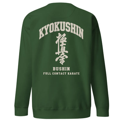 A dark green crewneck sweatshirt shown from the back, featuring a cream-colored graphic print with the words 'KYOKUSHIN', Japanese characters, 'BUSHIN', and 'FULL CONTACT KARATE'.