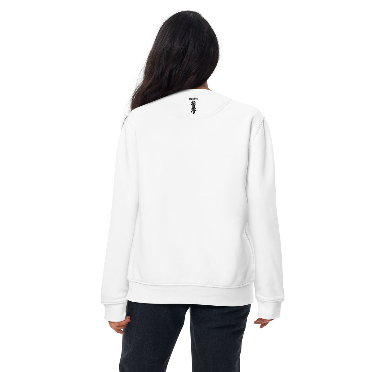 Person wearing a white sweatshirt with a logo on the back against a white background