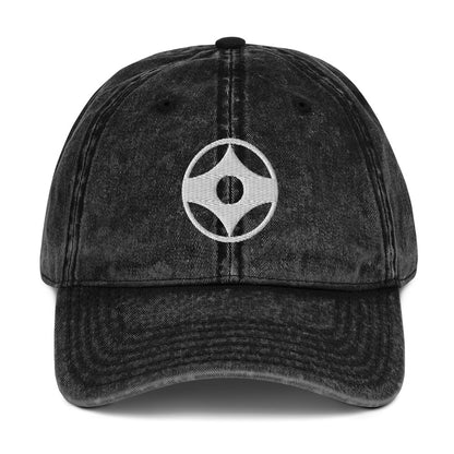 Black denim cap with white text on a white background