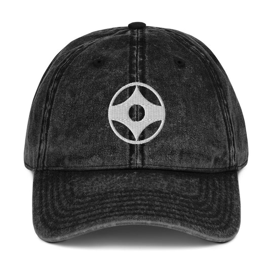 Black denim cap with white text on a white background