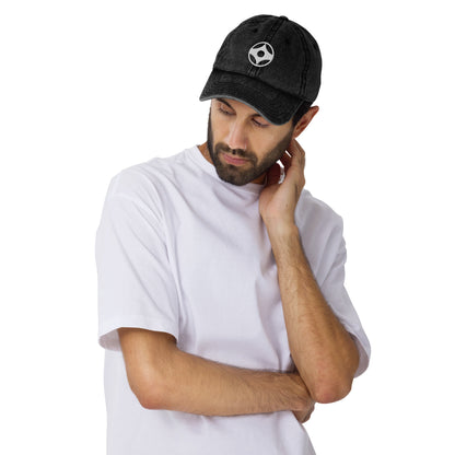Man wearing a black cap with kanku on a white background
