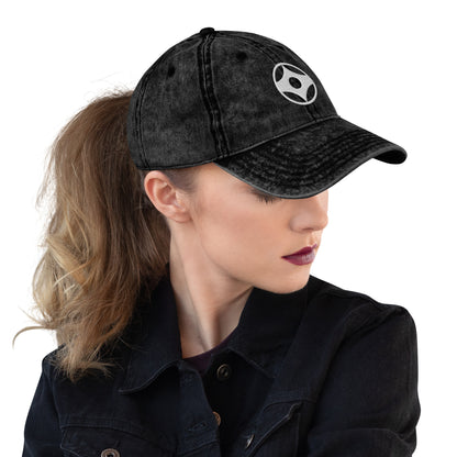 Woman wearing a black cap with Kanku on a white background